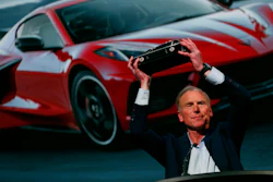 Tadge Juechter, Corvette executive chief engineer, holds up the trophy after the new mid-engine Corvette was named the North American Car of the Year in Detroit, Jan. 13, 2020.