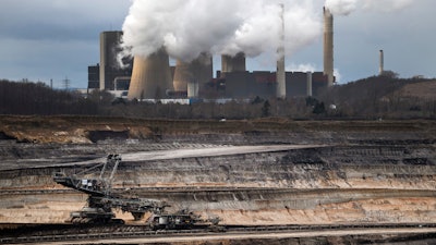 A mining machine is working in the Inden opencast lignite mine in Schophoven, Germany, Jan. 14, 2020.