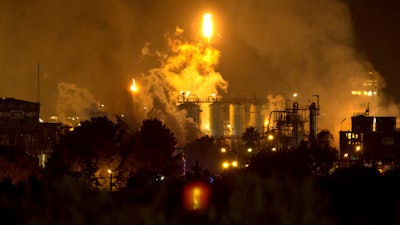 Smoke rises following an explosion at an industrial hub near Tarragona, Spain, Jan. 14, 2020.