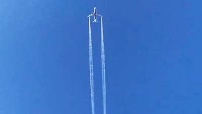 In this photo from video, Delta Air Lines Flight 89 to Shanghai dumps fuel over Los Angeles before returning to Los Angeles International Airport for an emergency landing, Jan. 14, 2020.