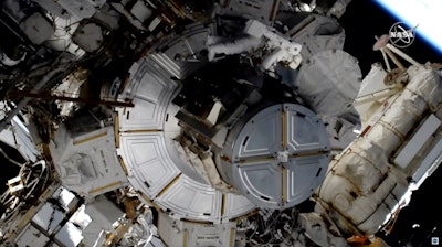 In this image taken from NASA video, NASA astronaut Jessica Meir works to finish upgrading the International Space Station's power grid, Jan. 15, 2020.
