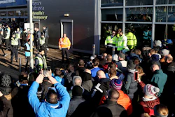 Fans crowd outside the Cardiff City stadium ahead of a match against Swansea City as South Wales police test facial recognition technology, Jan. 12, 2020.