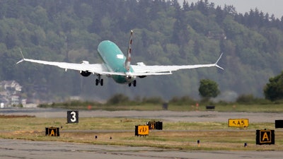 In this May 8, 2019, file photo, a Boeing 737 Max 8 takes off on a test flight in Renton, Wash.