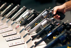 In this Jan. 19, 2016, file photo, handguns are displayed at the Smith & Wesson booth at the Shooting, Hunting and Outdoor Trade Show in Las Vegas.