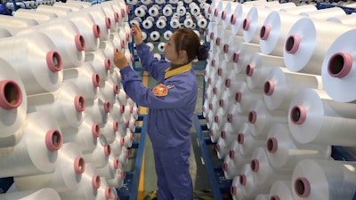 An employee works in a chemical fiber plant in Nantong, China, Jan. 17, 2020.