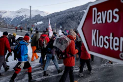 Hundreds of climate protesters who are on a three-day protest march from Landquart to Davos pass the city of Klosters, Switzerland, Jan. 20, 2020.