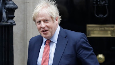 Prime Minister Boris Johnson leaves 10 Downing Street to attend the weekly session of Prime Ministers Questions in Parliament, London, Jan. 22, 2020.
