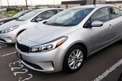 In this June 26, 2018, file photo, a used 2017 Kia Forte sits in a row of other used, late-model sedans at a dealership in Centennial, Colo.