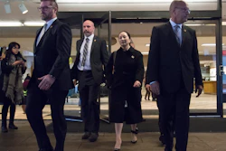 Meng Wanzhou, chief financial officer of Huawei, is flanked by security as she leaves B.C. Supreme Court in Vancouver, January 23, 2020.