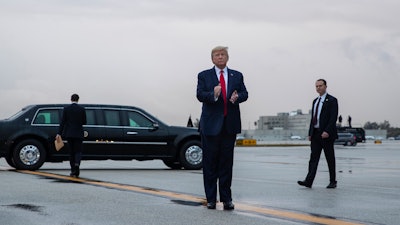 President Donald Trump arrives at Miami International Airport en route to the Republican National Committee winter meetings, Jan. 23, 2020.