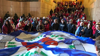 In this Nov. 21, 2019, file photo, demonstrators against a proposed liquid-natural gas pipeline and export terminal in Oregon flood into the State Capitol in Salem.
