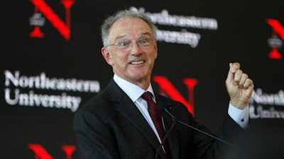 David Roux speaks at a news conference to announce his investment in Northeastern University to establish a graduate school and research center in Portland, Maine, Jan. 27, 2020.