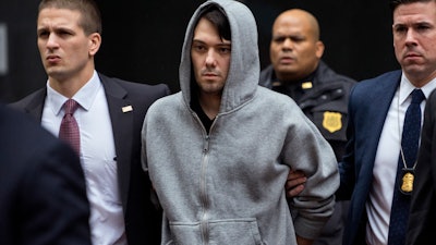 In this Dec. 17, 2015, file photo, Martin Shkreli is escorted by law enforcement agents in New York.