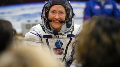 In this March 14, 2019, file photo, U.S. astronaut Christina Koch speaks with her relatives at the Baikonur cosmodrome, Kazakhstan.