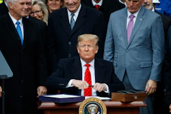 President Donald Trump prepares to sign a new North American trade agreement with Canada and Mexico during an event at the White House, Jan. 29, 2020.