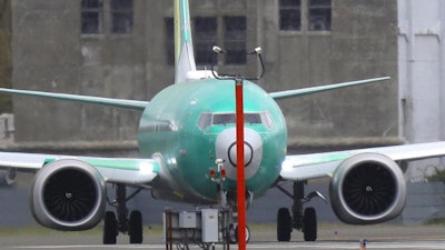 A Boeing 737 Max 8 airplane turns before taking off on a test flight, April 10, 2019, at Boeing Field in Seattle.