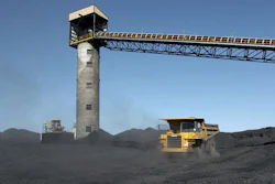 Heavy equipment moves coal, Aug. 28, 2009, outside Signal Peak Energy's Bull Mountain mine near Roundup, Mont.
