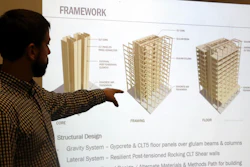 Structural engineer Eric McDonnell shows diagrams of skyscraper construction using cross-laminated timber at Portland State University, Portland, Ore., Nov. 15, 2016.