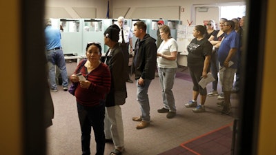 People vote at the Enterprise Library, Nov. 6, 2018, in Las Vegas.