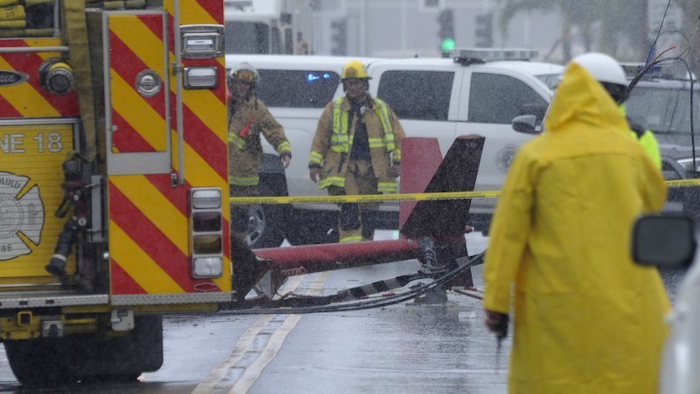 In this April 29, 2019, file photo, a portion of the tail section of a helicopter is shown after crashing in Kailua, Hawaii.