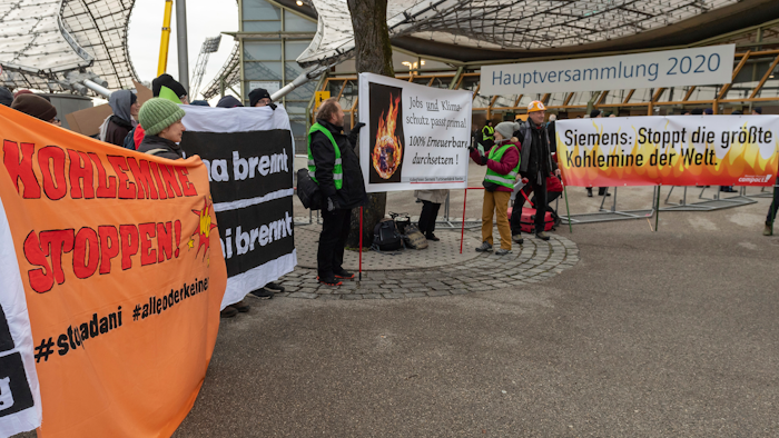 Climate activists demonstrate outside the Olympic Hall during Siemens' annual shareholders' meeting in Munich, Feb. 5, 2020.