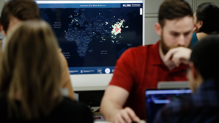 Kyle Martin, a worker at HealthMap, mines health data at Boston Children's Hospital, Feb. 13, 2020.
