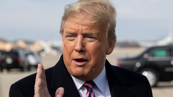 President Trump speaks with reporters as he boards Air Force One, Andrews Air Force Base, Md., Feb. 18, 2020.