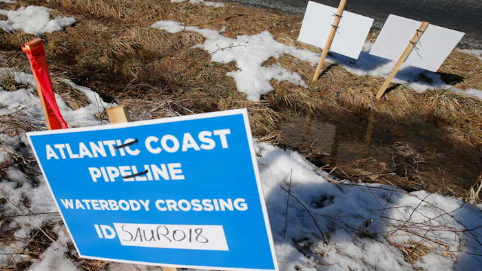 Signs mark the route of the Atlantic Coast Pipeline in Deerfield, Va., Feb. 8, 2018.