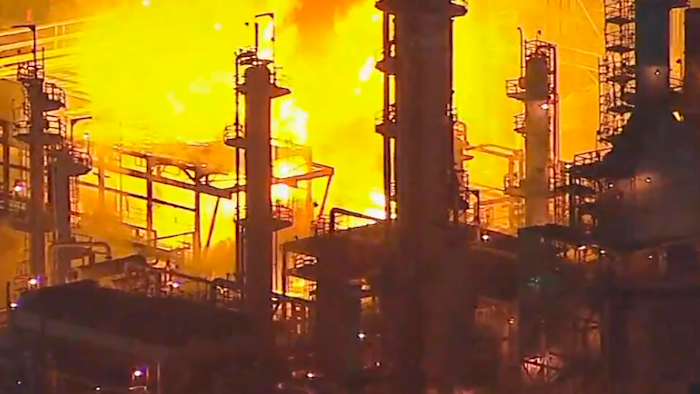 Photo taken from KABC-TV video showing a fire at the Marathon Petroleum refinery, Carson, Calif., Feb. 25, 2020.
