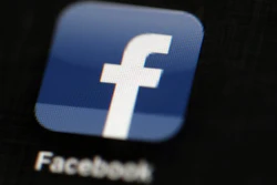 In this May 16, 2012, file photo, the Facebook logo is displayed on an iPad in Philadelphia.