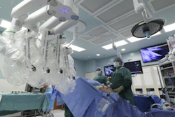 A team prepares to attach a da Vinci robot to a patient while performing a robotic assisted laparoscopic prostatectomy at CHI Memorial Hospital, Nov. 2, 2016, in Chattanooga, Tenn.