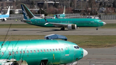 In this March 22, 2019, file photo, a Boeing 737 Max 8 taxis before takeoff from Renton Municipal Airport in Renton, Wash.