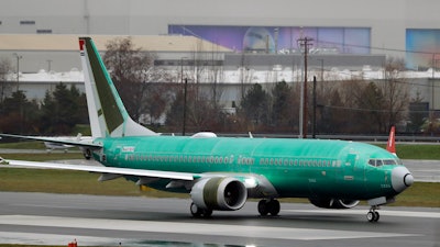 A Boeing 737 Max taxis for a test flight in Renton, Wash., Dec. 11, 2019.
