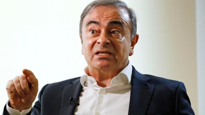 Former Nissan Chairman Carlos Ghosn speaks to Japanese media during an interview in Beirut, Jan. 10, 2020.