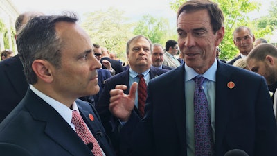 Braidy Industries CEO Craig Bouchard, right, and Gov. Matt Bevin speak with reporters in Wurtland, Ky., April 26, 2017.
