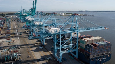 A container ship is unloaded at the Virginia International Gateway terminal in Norfolk, Va., May 10, 2019.