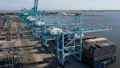 In this May 10, 2019, file photo, a container ship is unloaded at the Virginia International Gateway terminal in Norfolk, Va.