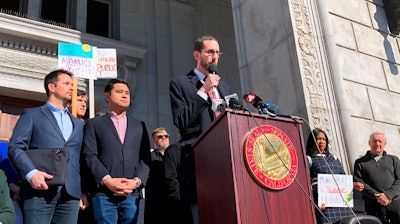 California state Sen. Scott Wiener announces he will introduce legislation to take over Pacific Gas & Electric at a rally in San Francisco, Feb. 3, 2020.