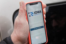 Precinct captain Carl Voss displays the Iowa Democratic Party caucus reporting app in Des Moines, Feb. 4, 2020.