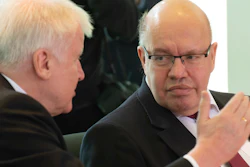 German Interior Minister Horst Seehofer, left, talks with Economy Minister Peter Altmaier at the chancellery in Berlin, Feb. 5, 2020.