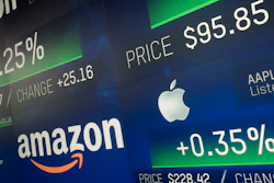 In this Sept. 4, 2018, file photo, Amazon and Apple stock prices are shown on an electronic screen at the Nasdaq MarketSite in New York.
