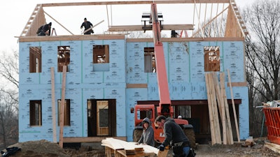 In this Jan. 4, 2019, file photo, work continues on a plan of new homes in Franklin Park, Pa.