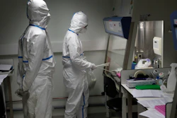 French scientists manipulate patient samples at the Pasteur Institute in Paris, Feb. 6, 2020.