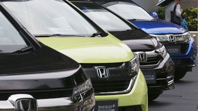 In this July 31, 2019, file photo, Honda cars are displayed at the automaker's headquarters in Tokyo.