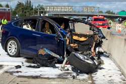 In this March 23, 2018, file photo, emergency personnel work at the scene of a Tesla crash on U.S. Highway 101, Mountain View, Calif.
