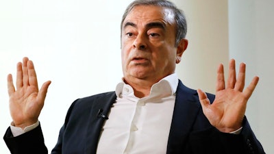 Former Nissan Chairman Carlos Ghosn speaks to Japanese media during an interview in Beirut, Jan. 10, 2020.