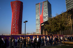 Attendees walk to enter the Mobile World Congress wireless show in Barcelona, Feb. 25, 2019.