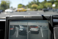 A police vehicle reads the license plates of cars in a parking lot in San Marcos, Calif., Sept.17, 2014.