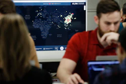 Kyle Martin, a worker at HealthMap, mines health data at Boston Children's Hospital, Feb. 13, 2020.