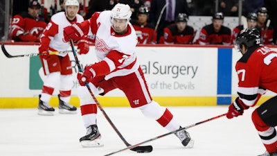 Detroit Red Wings center Dylan Larkin shoots during a game against the New Jersey Devils in Newark, N.J., Feb. 13, 2020.